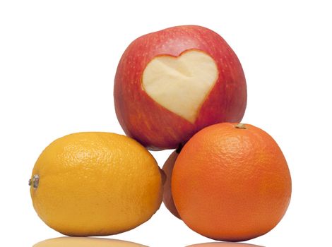 apple with a heart carved on a white background