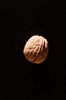 walnut on black background