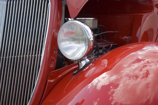 Grill and headlight of a hot rod 40s vintage car.