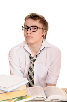 teenager student sits behind a desk isolated on white background