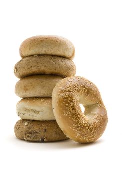 Six healthly lifestyle bagels in a stack.