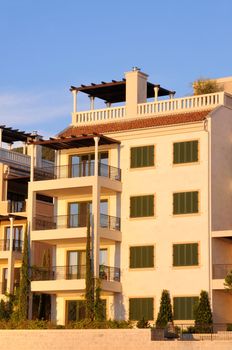 Mediterranean apartments against blue sky on sunset