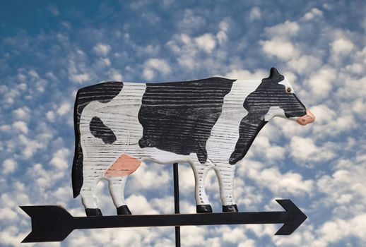 Wooden hand crafted cow weather vane.