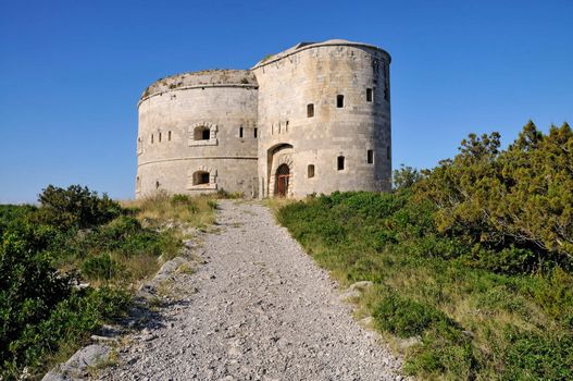 Fortress Arza on the peninsula Lustica built in 18th century, firs line of defense in entrees of Boka Kotorska bay