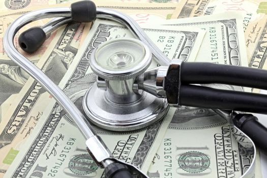 Stethoscope on Money Dollar Cash Currency Banknote Background Using for Healthy Financial and Insurance Concept
