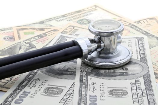 Stethoscope on Money Dollar Cash Currency Banknote Background Using for Healthy Financial and Insurance Concept