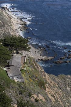 Big Sur, CA. Couple older homes right on the cliff on the shore of the Pacific ocean in California, Big Sur.