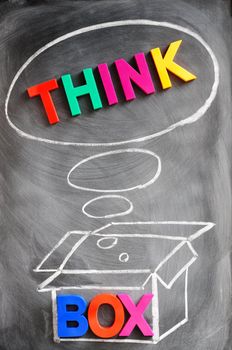 Think outside the box - concept made of colorful letters and chalk drawing