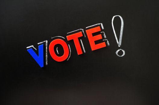 Vote with a big exclamation mark on a blackboard