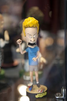 Beavis from "Beavis and Butthead" bobblehead character, behind glass.