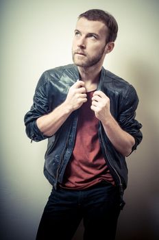vintage portrait of fashion guy on gray background