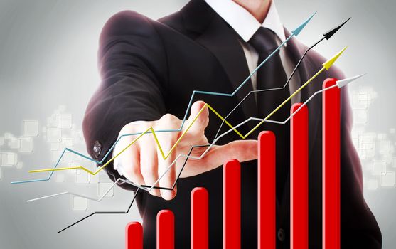Businessman with graph representing growth 