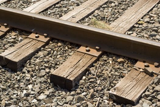 A closeup of some weathered railroad tracks.