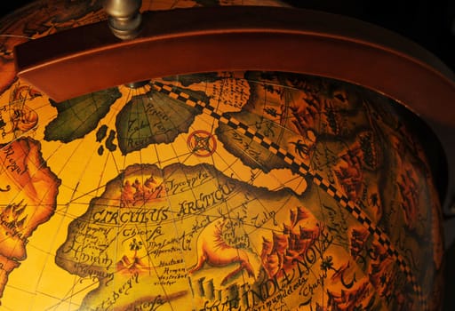 Old Style Wooden World Globe On Dark Background.