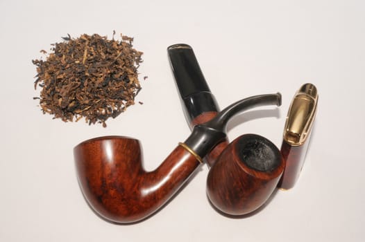Tobacco,  Lighter And Two Smoking Pipes On White Background. 