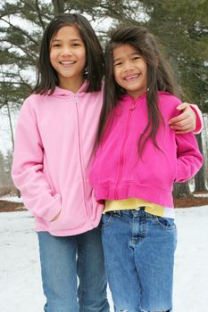 Two sisters enjoying the utdoors in winter