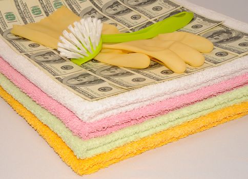 Brush And Glove Lying On Dollar Bills, Money Laundering Scheme.