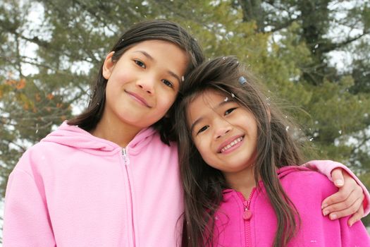 Two sisters enjoying the utdoors in winter