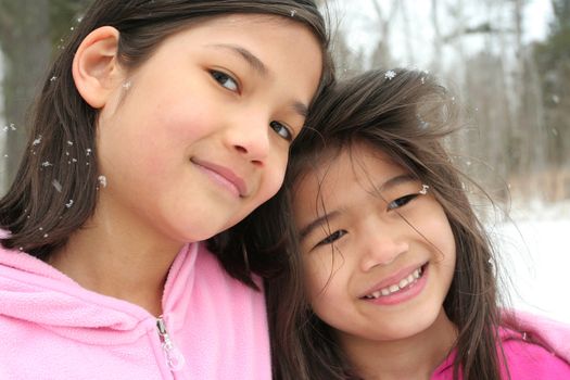 Two sisters enjoying the utdoors in winter