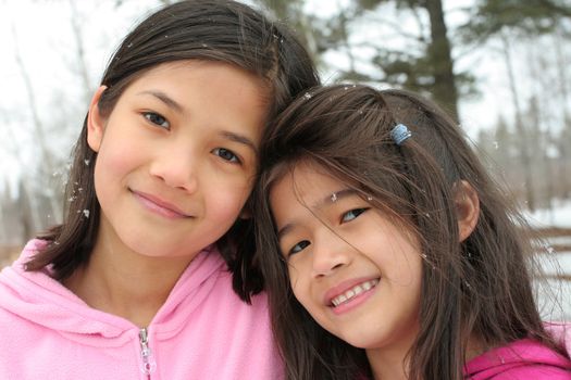 Two sisters enjoying the utdoors in winter