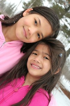 Two sisters enjoying the utdoors in winter