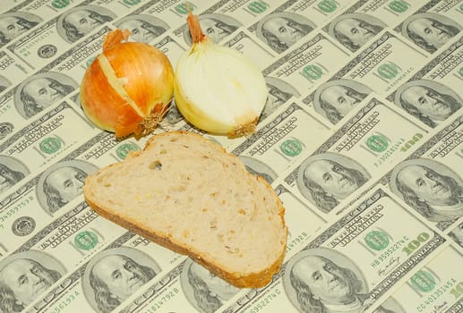 Bread And Onion On The One Hundred Dollar Bills Background.