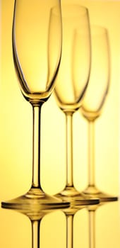 Tree Elegant Tall Wineglass For Champagne  Over Yellow  Background.