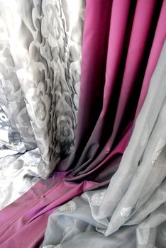 A collection of rich, vibrant satin fabrics