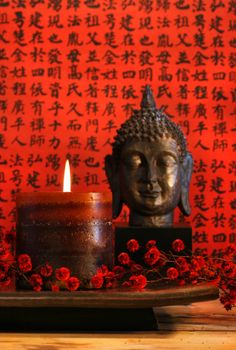 Asian candle with red orential background