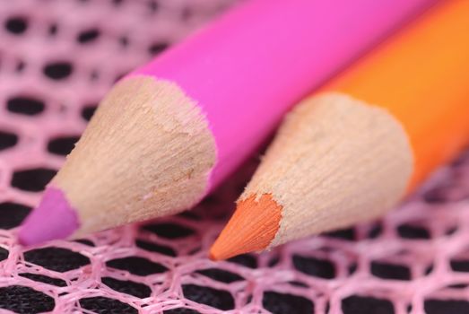 Graphite pencils. colored pencils close-up on a dark background