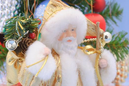 Santa Claus against a backdrop of green spruce with gifts