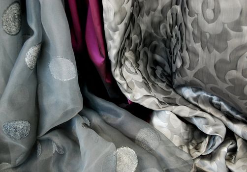 A collection of rich, vibrant satin fabrics