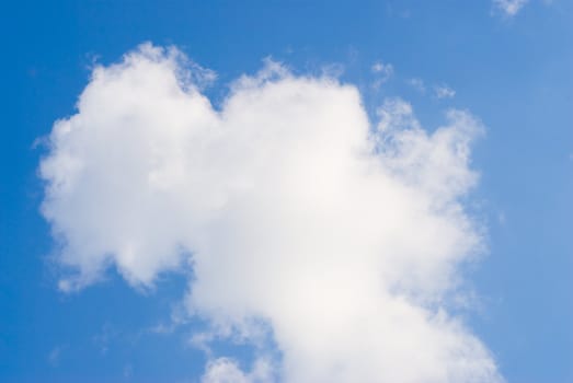 A large white cloud in the blue sky