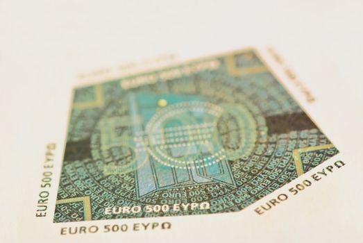 Hologram - iridescent multifaceted picture metallize foil, laminated on banknotes 500 euro