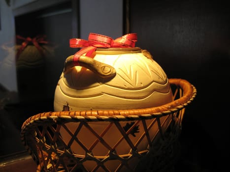 a decoration with a pot in a basket