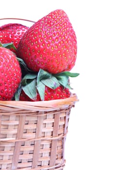 Small basket of strawberries on white