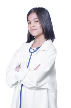 Nine year old girl playing doctor with white lab coat and stethoscope