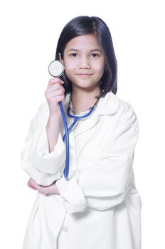 Nine year old girl playing doctor with white lab coat and stethoscope