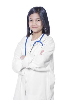 Nine year old girl playing doctor with white lab coat and stethoscope