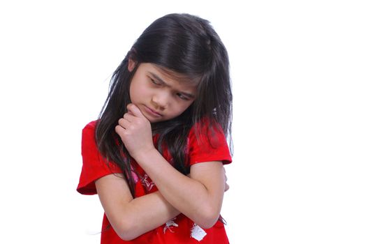 Little girl making a hard decision, hand on chin. Part Asian, Scandinavian background