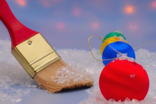 Snow removal around Christmas trinkets brush