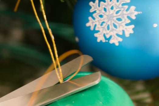 Trimmed string toys for Christmas spruce scissors
