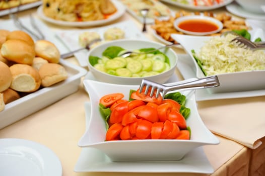 An assortment of salads on a buffet table