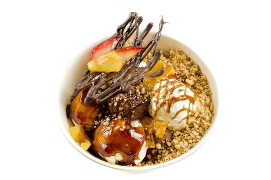 ice cream with chocolate, nuts and caramel close up