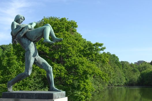 sculpture of a man bears a woman in the Vigeland park, Oslo