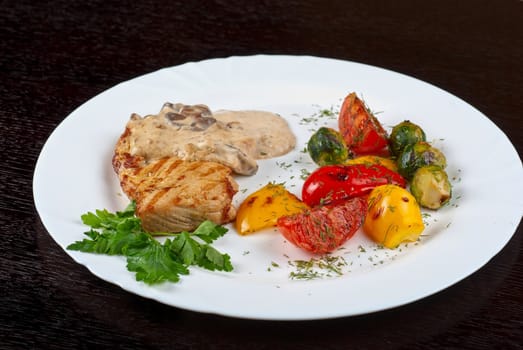 pork steak with mushroom sauce and grilled vegetables