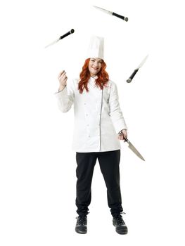 Juggling readhaired Chef isolated on white background