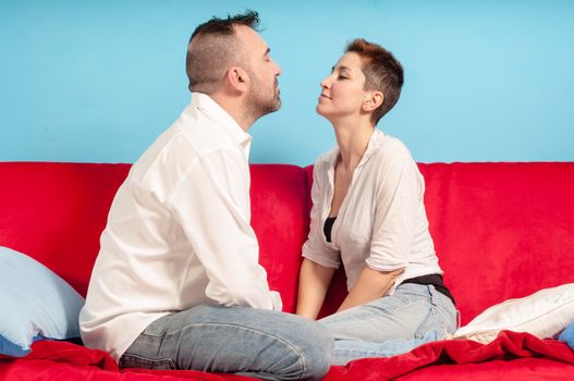 husband and wife hugging on the couch in the living room