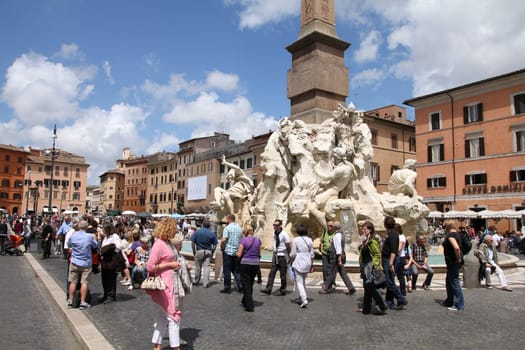 ROME - MAY 13: Tourists at Piazza Navona on May 13, 2010 in Rome, Italy. The iconic square is one of the most visited landmarks in the world and a top tourism destination in Italy.