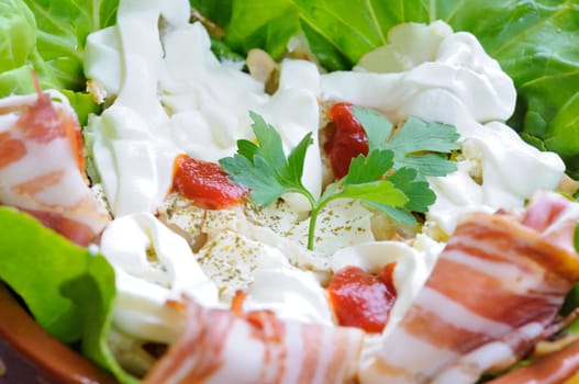 Salad with fresh lettuce and tasty bacon